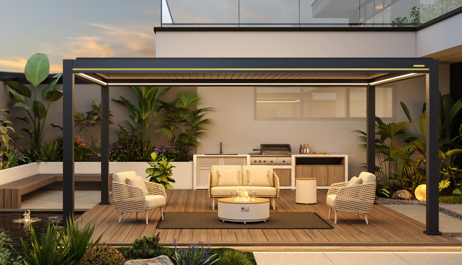 Pergola over an outdoor kitchen and lounge at dusk